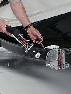 Megaware FlexStep Pro being set up and adjusted on a trailer frame