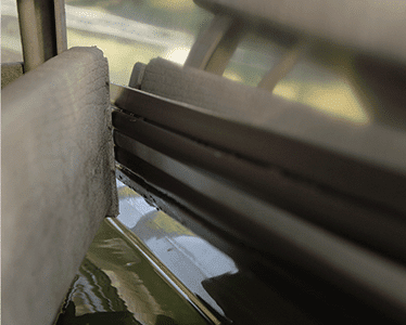 Megaware PontoonGuard installed along the edge of a gray pontoon tube
